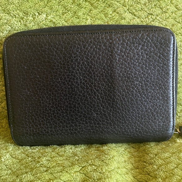 Dooney and Bourke zip along wallet in solid black. - Picture 2 of 12